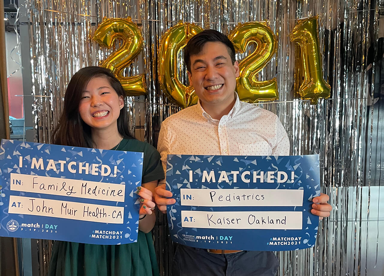 Students celebrate Match Day in front of balloons