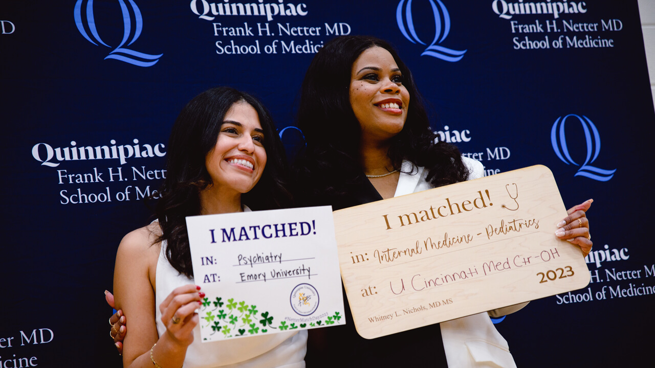 Students pose at Match Day 2023 with their respective matches.