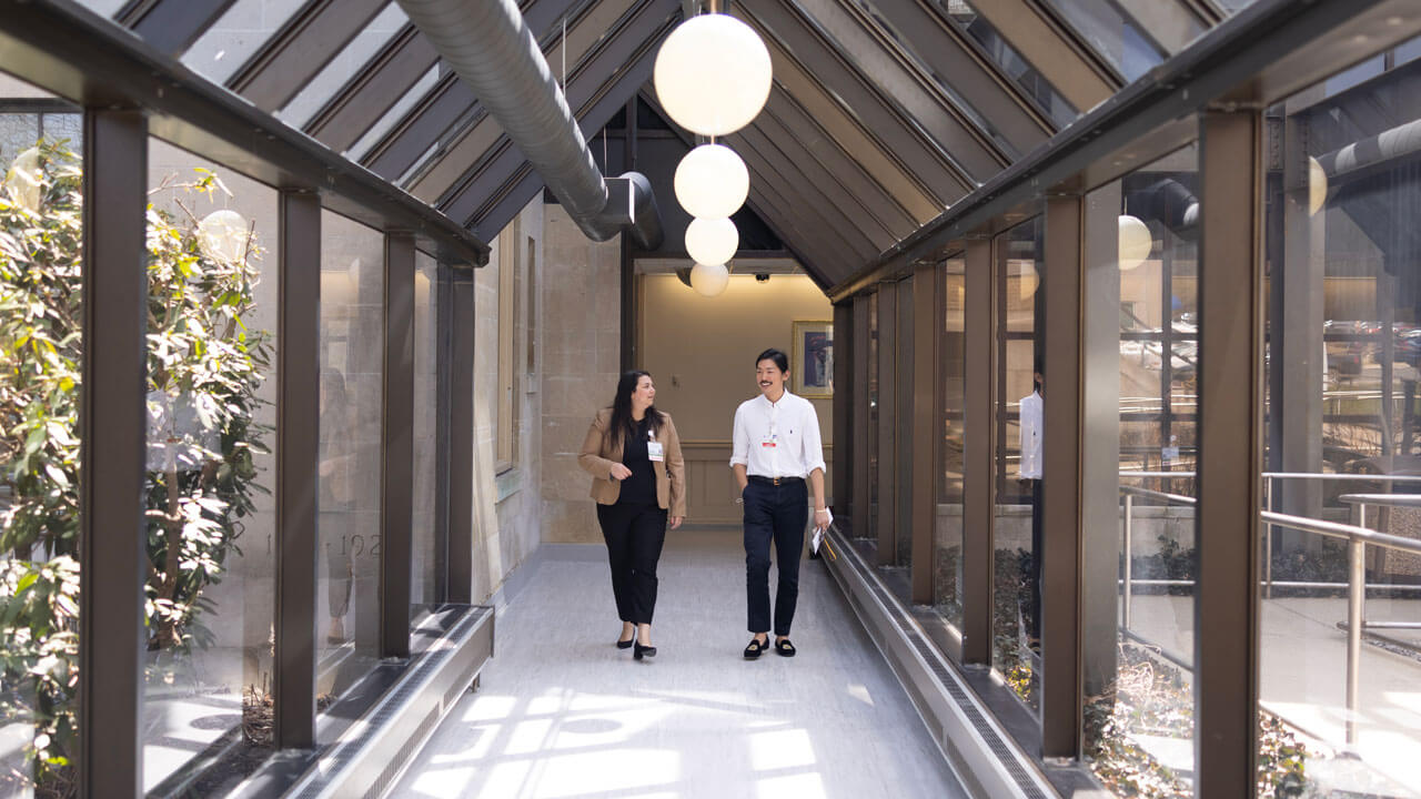 Two doctors walk in a hallway at Charlotte Hungerford Hospital